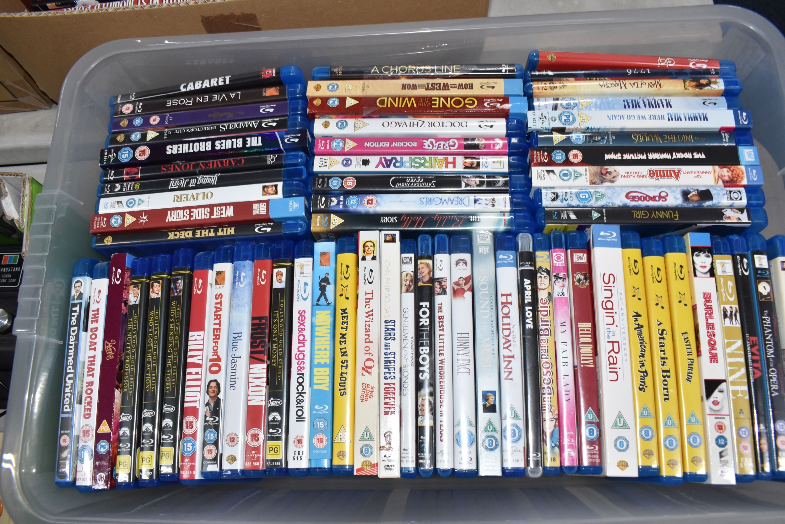 TWO BOXES OF DVDS AND BLU-RAY DISCS, over seventy DVDs, DVD sets and ...