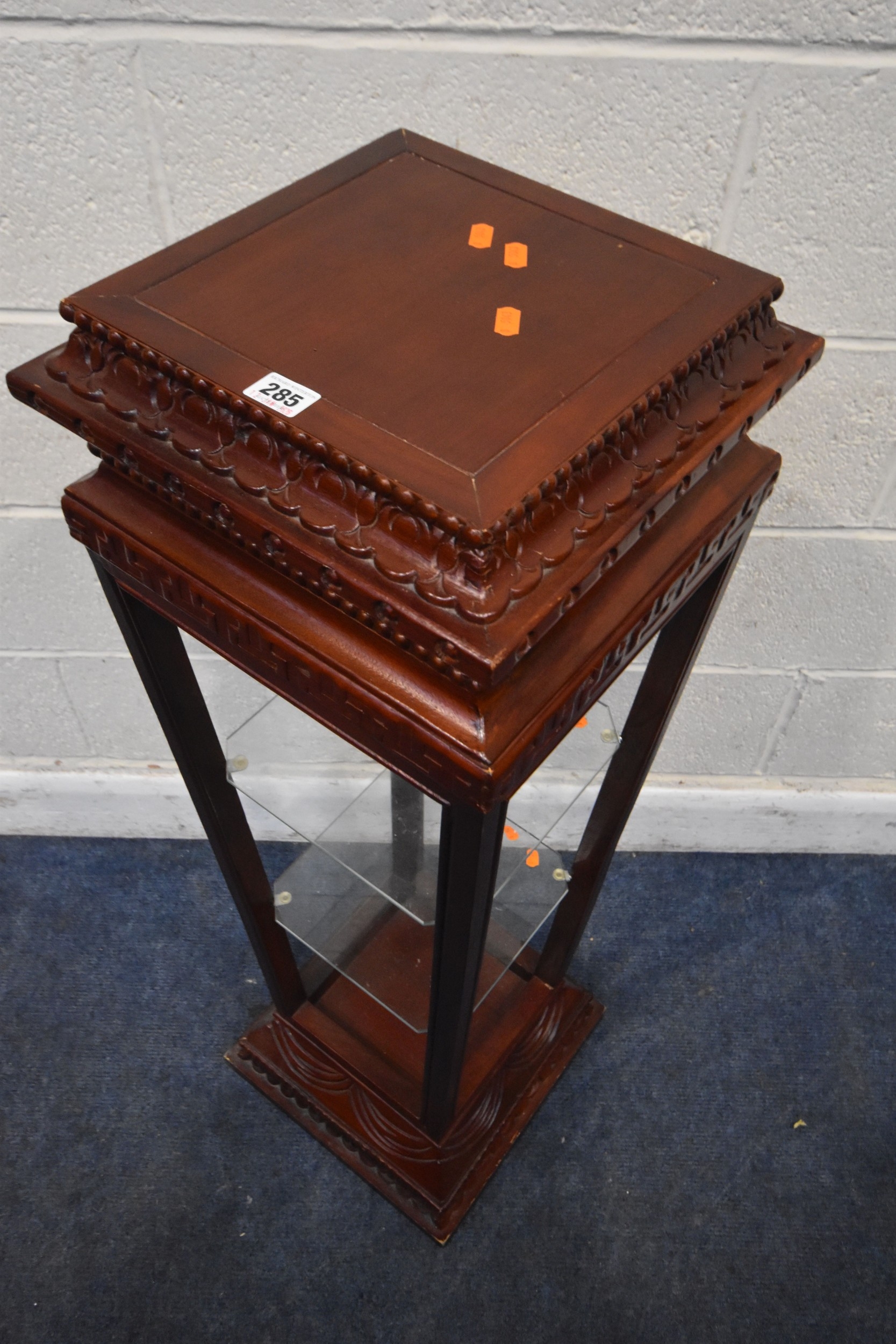 A HARDWOOD PYRAMID OPEN DISPLAY STAND, with two glass shelves, 33cm x ...