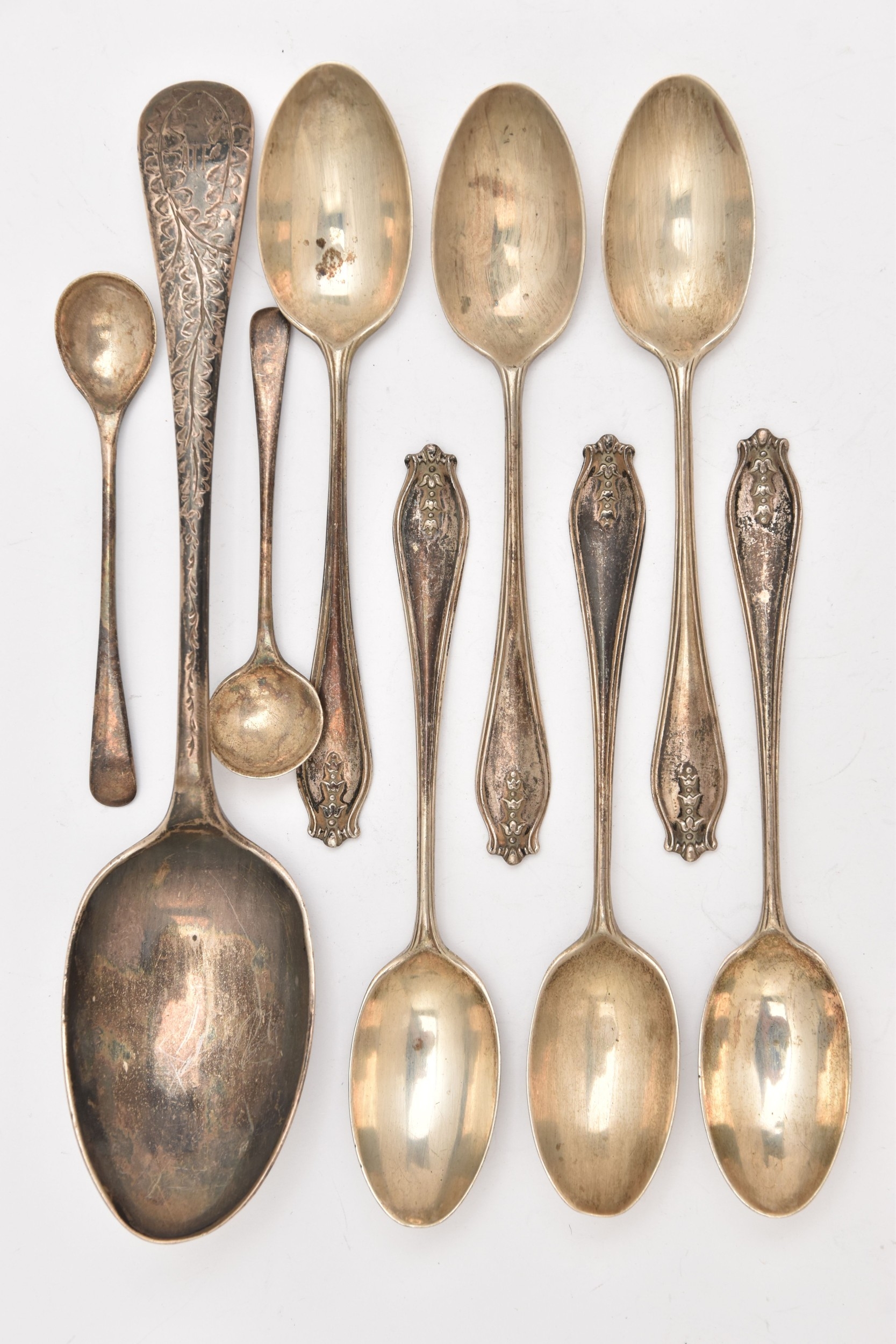 A SELECTION OF SILVER SPOONS, to include a desert spoon, a set of six ...