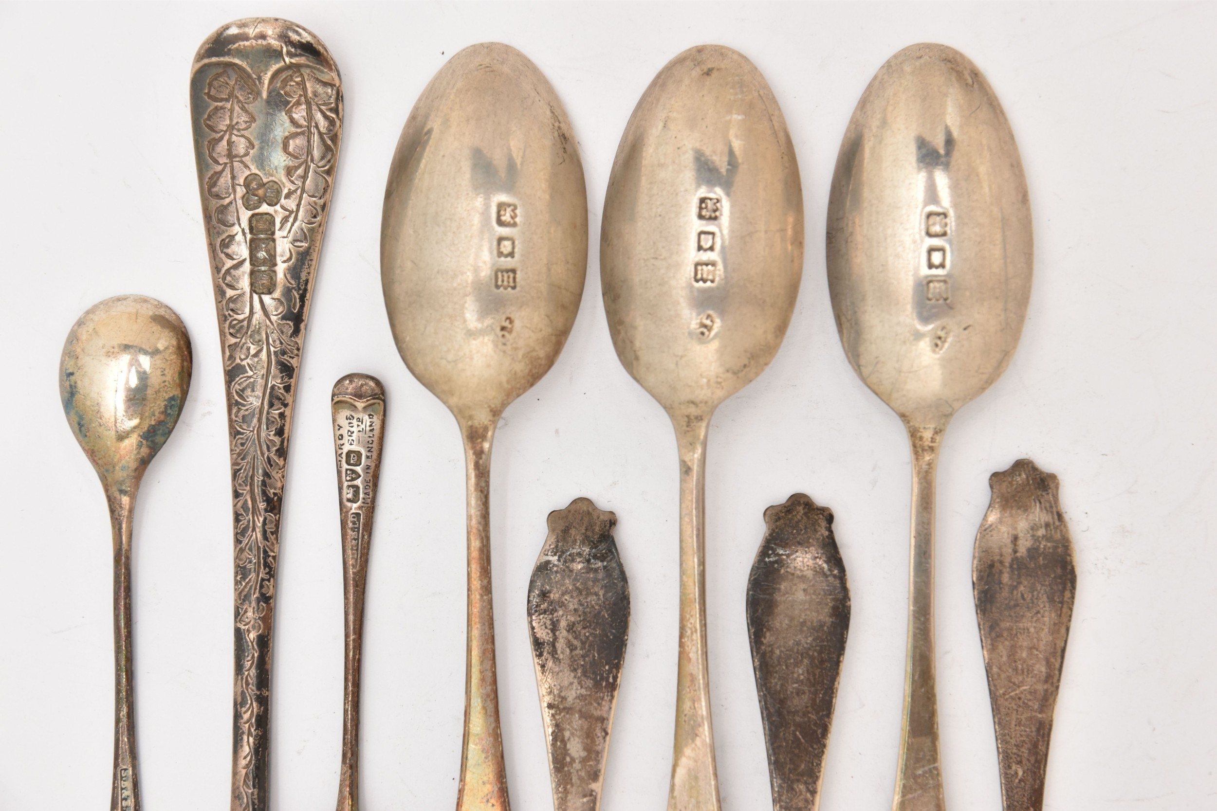A SELECTION OF SILVER SPOONS, to include a desert spoon, a set of six ...