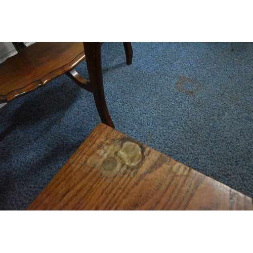 223 - A 20TH CENTURY OVAL TABLE, with a wavy edge, raised on four shaped legs, united by an undershelf, wi...