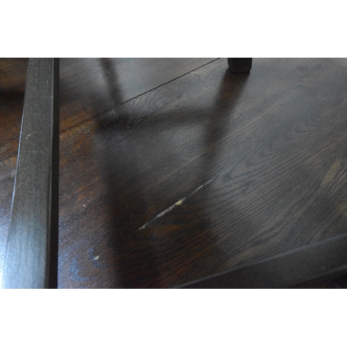 231 - AN EARLY 20TH CENTURY OAK OVAL GATE LEG TABLE, open width 149cm x closed width 49cm x depth 105cm x ...