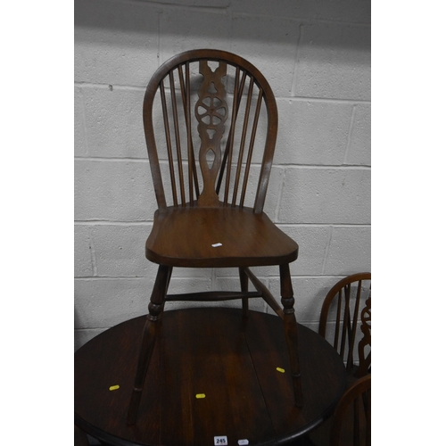 245 - AN EARLY 20TH CENTURY OAK GATE LEG TABLE, with barley twist supports, open width 90cm x closed width... 