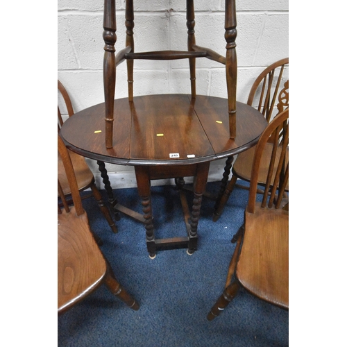 245 - AN EARLY 20TH CENTURY OAK GATE LEG TABLE, with barley twist supports, open width 90cm x closed width... 