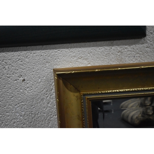 249 - A GILT WOOD RECTANGULAR BEVELLED EDGE WALL MIRROR, 98cm x 68cm, a smaller gilt wood mirror, and anot... 