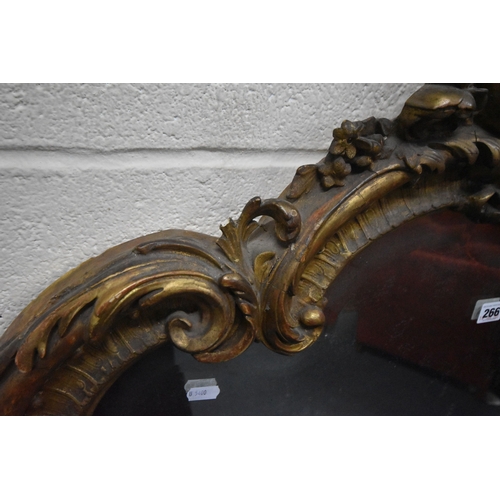 266 - A 19TH CENTURY GILT WOOD AND RESIN BEVELLED EDGE OVER-MANTEL MIRROR, with scrolled and foliate desig... 