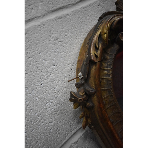 266 - A 19TH CENTURY GILT WOOD AND RESIN BEVELLED EDGE OVER-MANTEL MIRROR, with scrolled and foliate desig... 