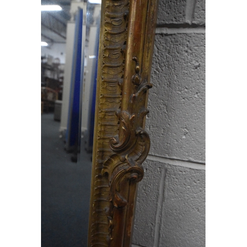 266 - A 19TH CENTURY GILT WOOD AND RESIN BEVELLED EDGE OVER-MANTEL MIRROR, with scrolled and foliate desig... 