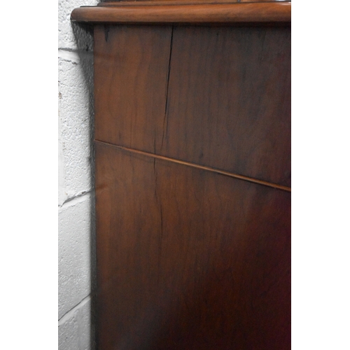 269 - A 19TH CENTURY MAHOGANY BOOKCASE, the double glazed doors enclosing three shelves, atop a base with ... 