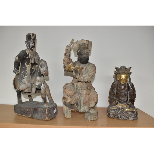 792 - A GROUP OF THREE CHINESE QING DYNASTY CARVED ANCESTRAL VOTIVE FIGURES comprising a figure riding a h... 