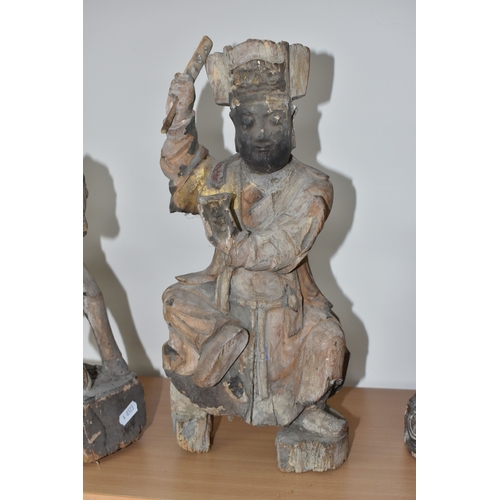 792 - A GROUP OF THREE CHINESE QING DYNASTY CARVED ANCESTRAL VOTIVE FIGURES comprising a figure riding a h... 