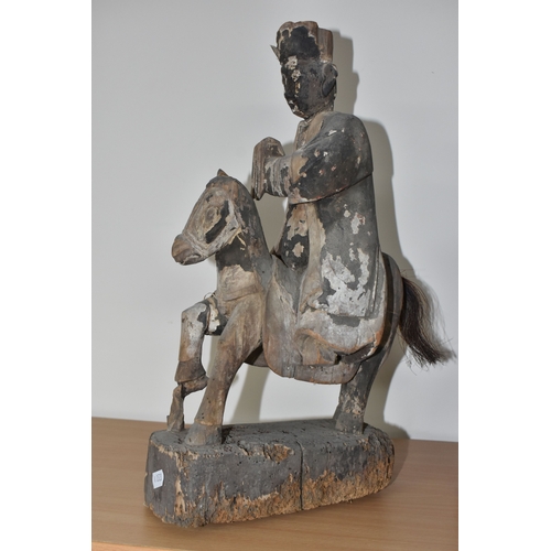 792 - A GROUP OF THREE CHINESE QING DYNASTY CARVED ANCESTRAL VOTIVE FIGURES comprising a figure riding a h... 