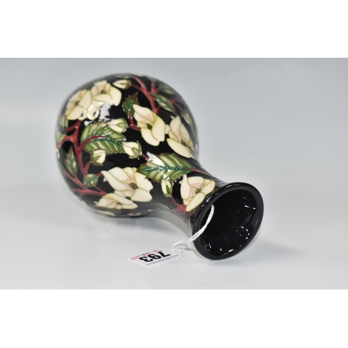 793 - A MOORCROFT POTTERY 'MOUNTAIN GOLD' VASE, designed by Sian Leeper, featuring tube line white and yel... 