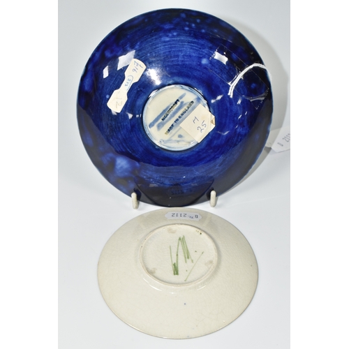 800 - TWO PIECES OF MOORCROFT POTTERY, a saucer featuring tube lined pomegranate pattern, diameter 13.5cm,... 