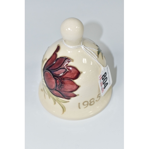 804 - A MOORCROFT POTTERY 1985 YEAR BELL, with a tube lined Anemone pattern on a cream ground, painted mar... 