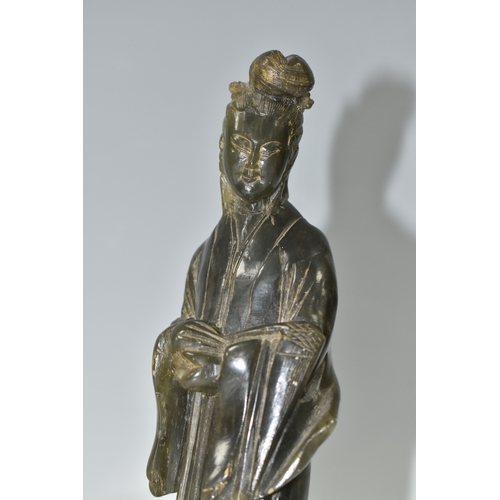 812 - TWO CHINESE CARVED NEPHRITE FIGURES possibly depicting He Xiangu comprising a sculpture of the figur... 