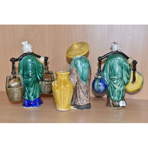 816 - A GROUP OF THREE CHINESE EXPORT MUD MEN FIGURES comprising two different figures carrying items with... 