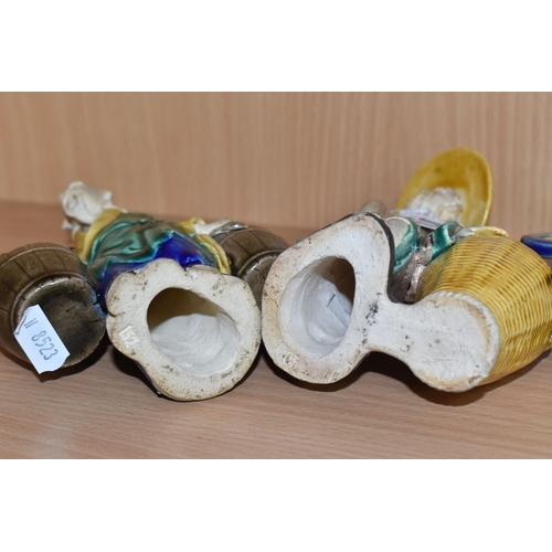 816 - A GROUP OF THREE CHINESE EXPORT MUD MEN FIGURES comprising two different figures carrying items with... 