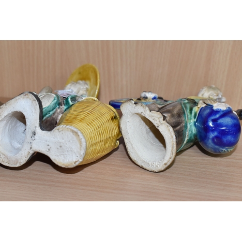 816 - A GROUP OF THREE CHINESE EXPORT MUD MEN FIGURES comprising two different figures carrying items with... 