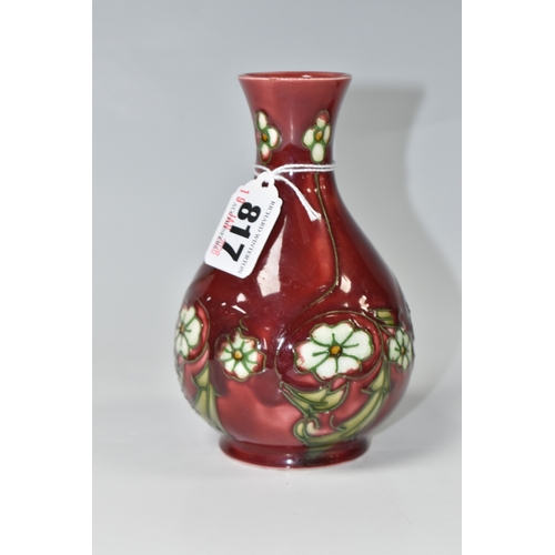 817 - A MINTON SECESSIONIST BALUSTER VASE, tube-lined with white flowers on a red ground, shape no 33, pri... 