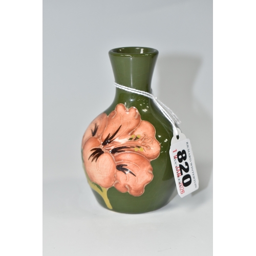 820 - A MOORCROFT POTTERY 'CORAL HIBISCUS' PATTERN VASE, the small bud vase tube-lined with coral pink hib... 
