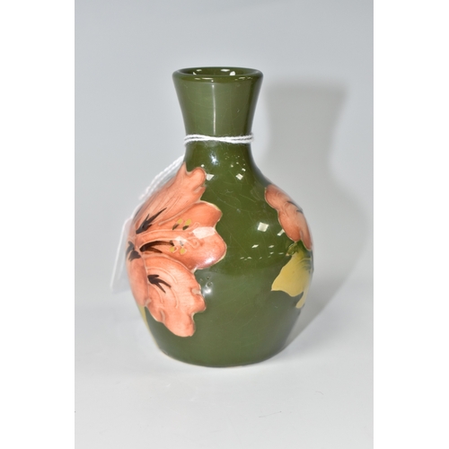 820 - A MOORCROFT POTTERY 'CORAL HIBISCUS' PATTERN VASE, the small bud vase tube-lined with coral pink hib... 