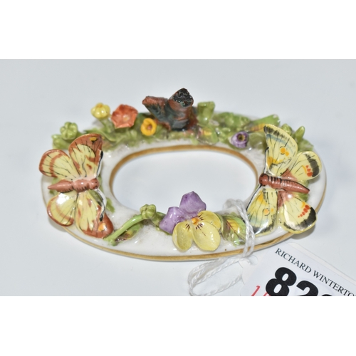 822 - A LATE NINETEENTH STEVENSON AND HANCOCK MENU CARD HOLDER, modelled with flowers and butterflies, pai... 