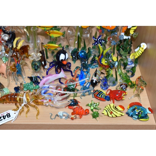 842 - A COLLECTION OF GLASS LAMPWORK ANIMALS AND FLOWERS, approximately two hundred pieces, to include sev... 