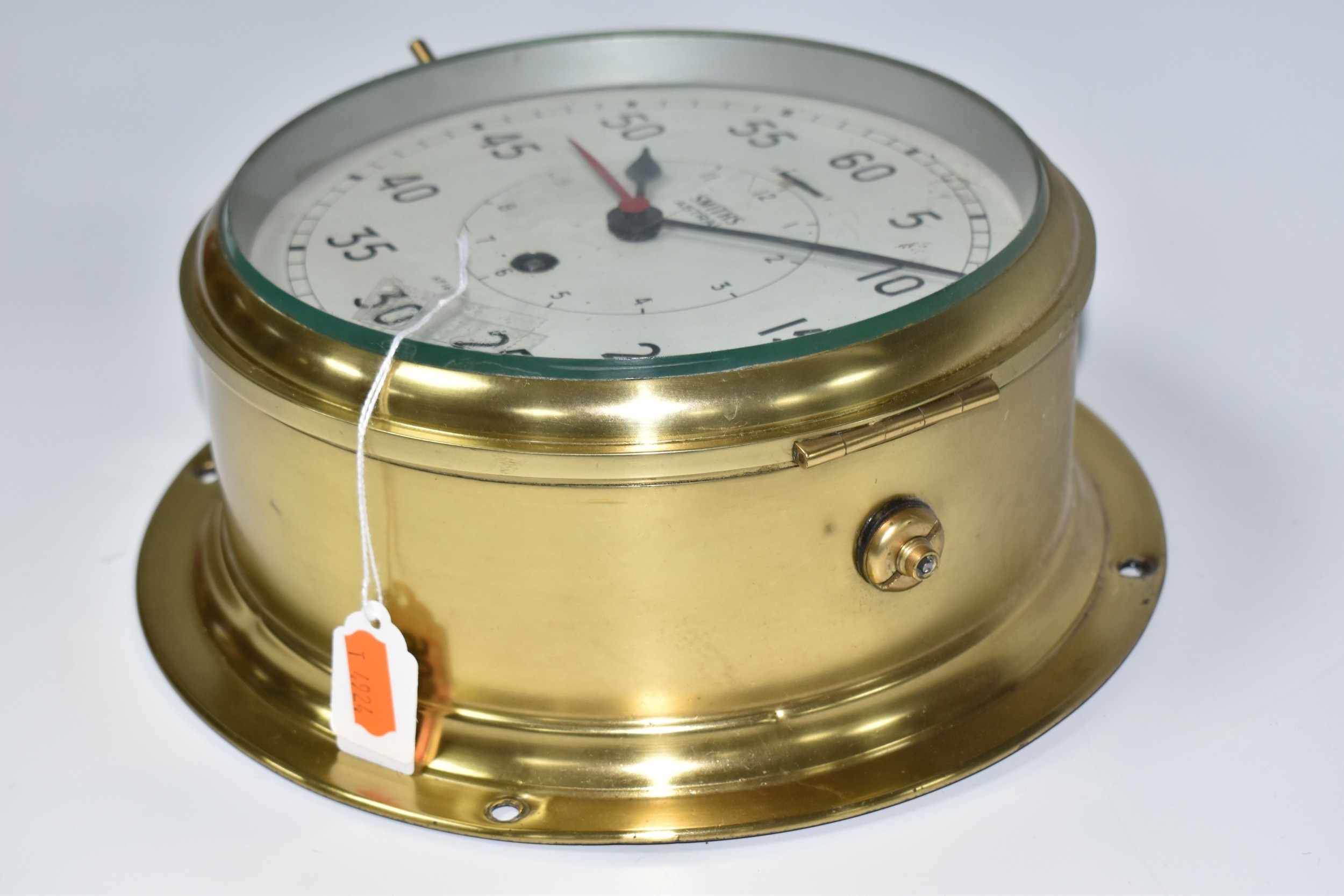 A SMITHS ASTRAL BRASS BULKHEAD CLOCK, the cream dial marked with Arabic ...