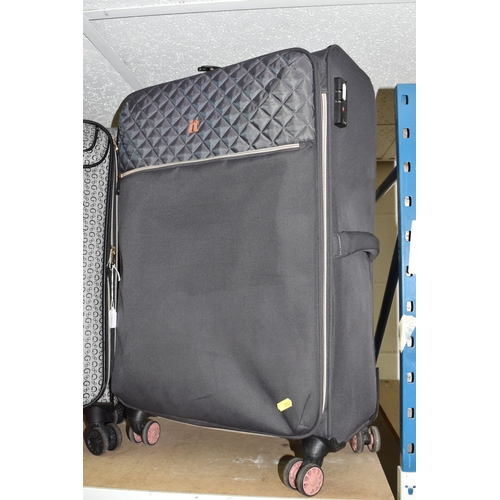 A GUESS CASSIAN MEDIUM SOFT SHELL SUITCASE, featured in grey with ...