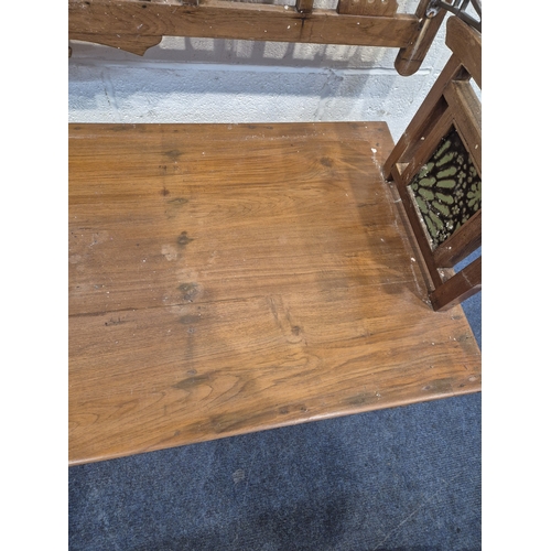 305 - AN ANGLO INDIAN TEAK BENCH, with a railway-style swinging back rest, inlaid with various tiles, rais... 