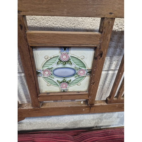 305 - AN ANGLO INDIAN TEAK BENCH, with a railway-style swinging back rest, inlaid with various tiles, rais... 