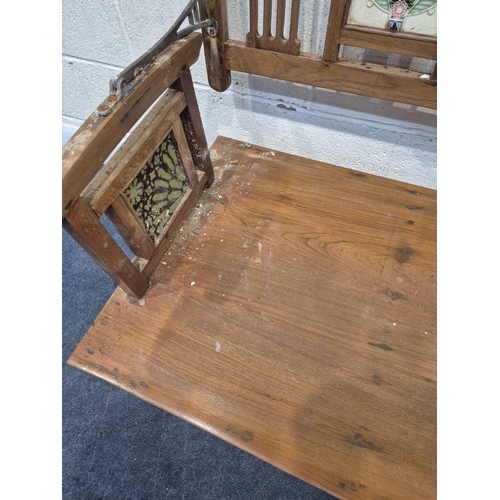 305 - AN ANGLO INDIAN TEAK BENCH, with a railway-style swinging back rest, inlaid with various tiles, rais... 