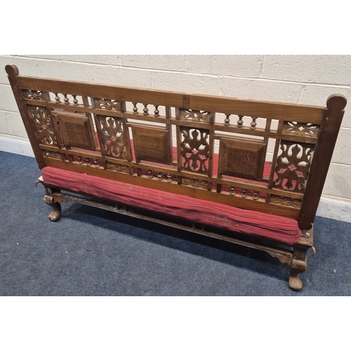 306 - AN ANGLO INDIAN TEAK BENCH, with a railway-style swinging back rest, inlaid with various tiles, rais... 