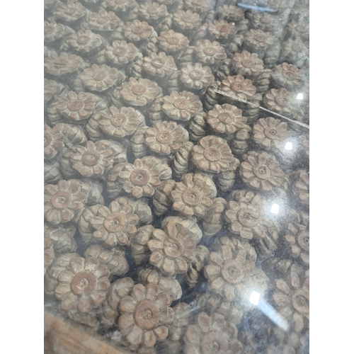 312 - A CARVED INDIAN RECTANGULAR COFFEE TABLE, with a glass insert, raised on block and turned legs, widt... 