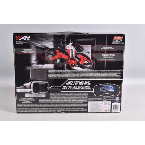 44 - A REMOTE CONTROLLED KYOSHO CHASSIS, TWO BOXED DRONES AND A RADIO CONTROLLER, Kyosho chassis worn wit... 