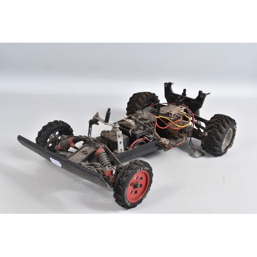 44 - A REMOTE CONTROLLED KYOSHO CHASSIS, TWO BOXED DRONES AND A RADIO CONTROLLER, Kyosho chassis worn wit... 