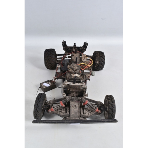 44 - A REMOTE CONTROLLED KYOSHO CHASSIS, TWO BOXED DRONES AND A RADIO CONTROLLER, Kyosho chassis worn wit... 