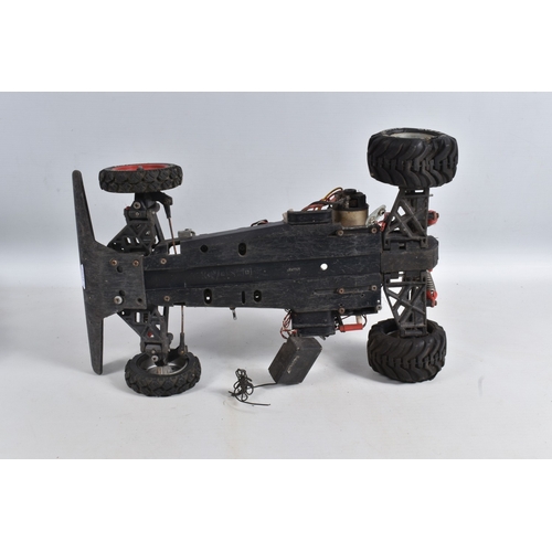 44 - A REMOTE CONTROLLED KYOSHO CHASSIS, TWO BOXED DRONES AND A RADIO CONTROLLER, Kyosho chassis worn wit... 