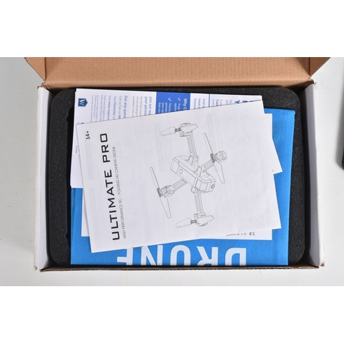 44 - A REMOTE CONTROLLED KYOSHO CHASSIS, TWO BOXED DRONES AND A RADIO CONTROLLER, Kyosho chassis worn wit... 