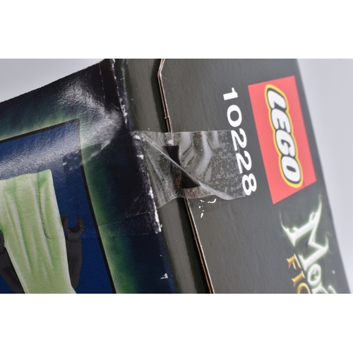 75 - A BOXED LEGO MONSTER FIGHTERS HAUNTED HOUSE, reference 10228, appears new with sticker tabs numbered... 