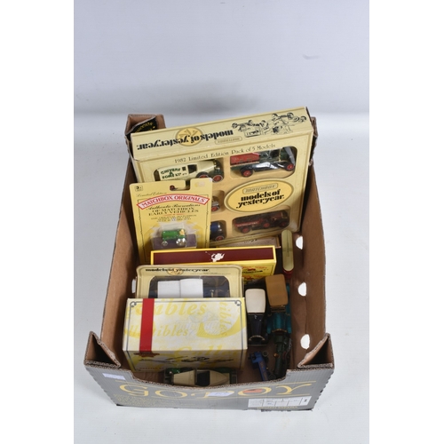 192 - A QUANTITY OF BOXED AND LOOSE DIECAST TRAMS, BUSES, COACHES, AND TRANSPORT MODELS, included is a lar... 