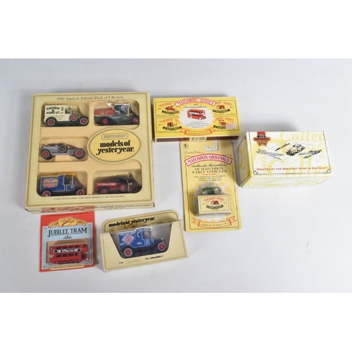 192 - A QUANTITY OF BOXED AND LOOSE DIECAST TRAMS, BUSES, COACHES, AND TRANSPORT MODELS, included is a lar... 