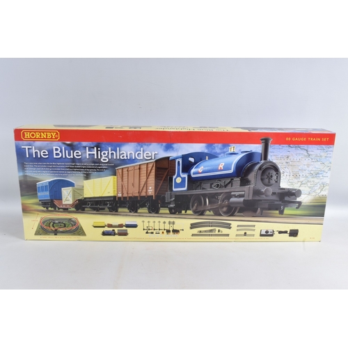 242 - A BOXED HORNBY RAILWAYS OO GAUGE THE BLUE HIGHLANDER TRAIN SET, No.R1101, appears largely complete w... 