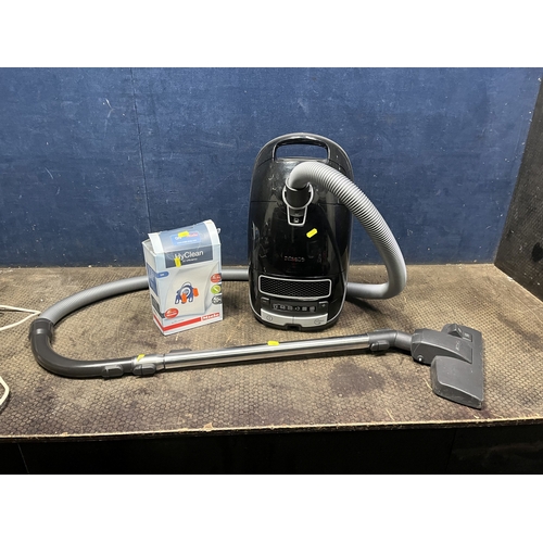 101 - A MIELE S8310 POWER PLUS VACUUM CLEANER (PAT pass and working) and a box with two spare bags