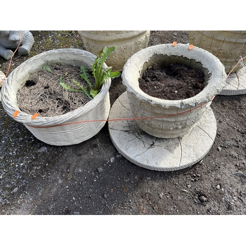 14 - FOUR ROUND CONCRETE PLANTERS AND TWO PLATTERS, including a set of two at 37cm and 31cm respectively ... 