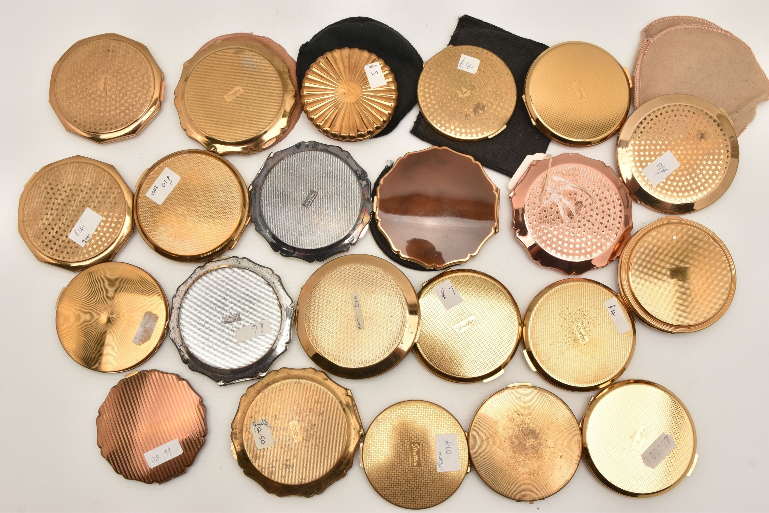TWENTY TWO 'STRATTON' COMPACTS, various designs some with pouches