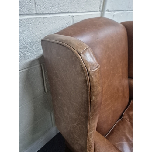 202 - A LAURA ASHLEY TANNED LEATHER WING BACK ARMCHAIR, raised on front cabriole legs, width 81cm x depth ... 