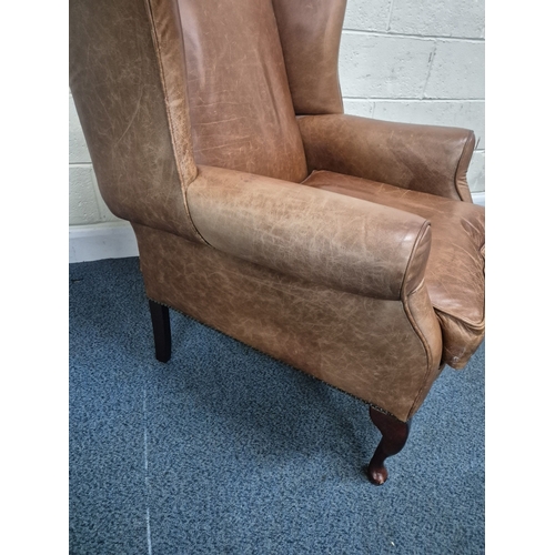 202 - A LAURA ASHLEY TANNED LEATHER WING BACK ARMCHAIR, raised on front cabriole legs, width 81cm x depth ... 