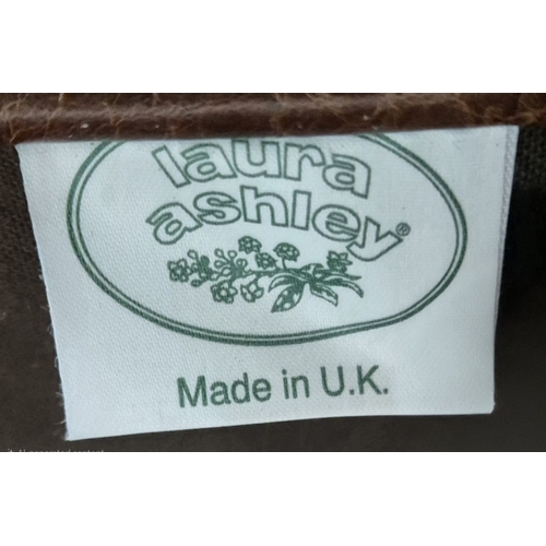 202 - A LAURA ASHLEY TANNED LEATHER WING BACK ARMCHAIR, raised on front cabriole legs, width 81cm x depth ... 